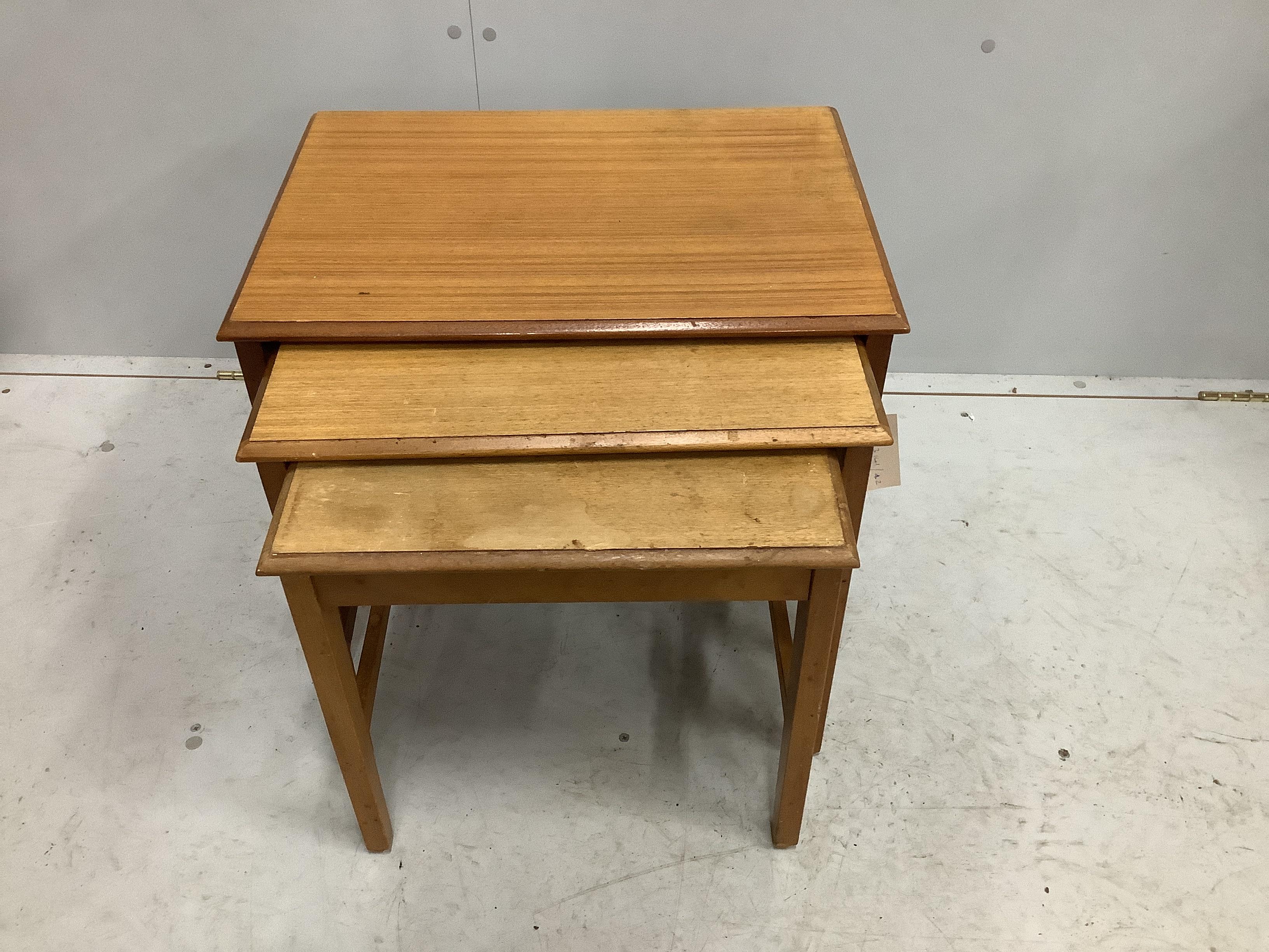 A mid century rectangular teak nest of three tables, width 55cm, depth 40cm, height 46cm